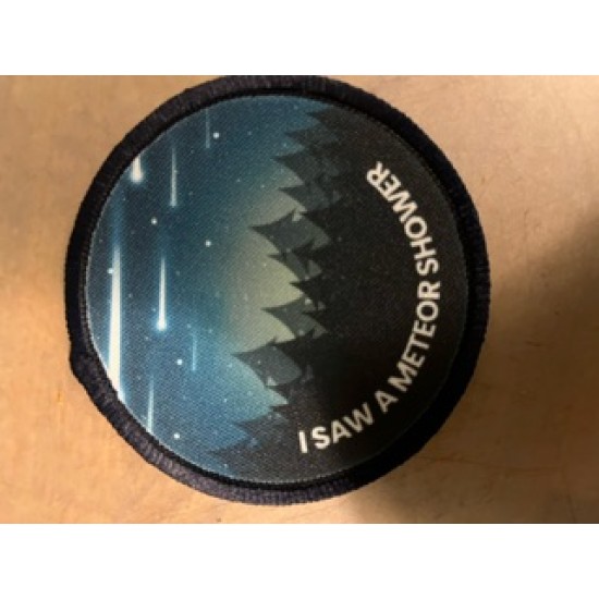 Printed 8cm meteor shower badge .  